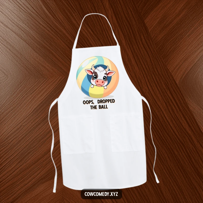 Funny Apron: A surprised cow peeking out from behind a giant striped beach ball, perfect for cooks who love comical beach themes.